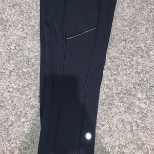 Lulu lemon leggings. With pockets on the sides and a zip up pocket in the back.